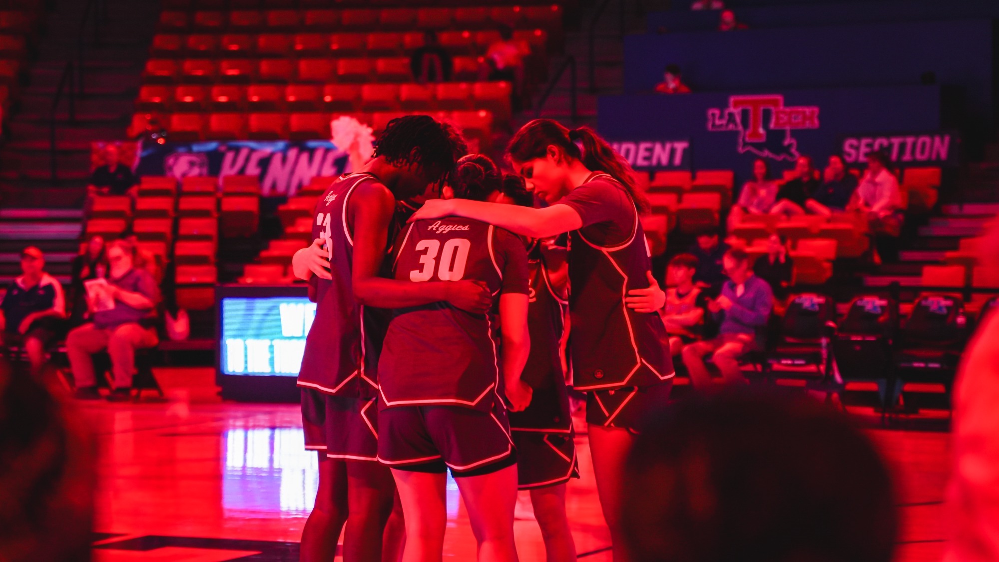 NM State starting lineup during a pre-game huddle against LA Tech (3/5)