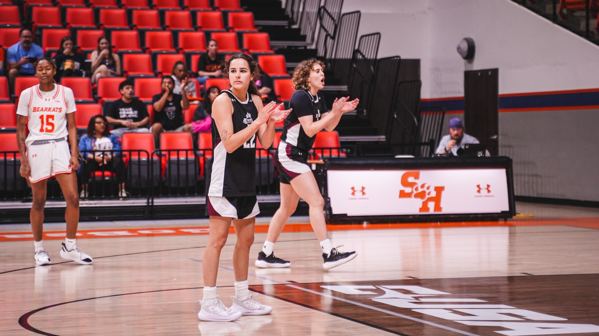 Emma Christiano and Loes Rozing celebrating on the floor against Sam Houston (3/7)