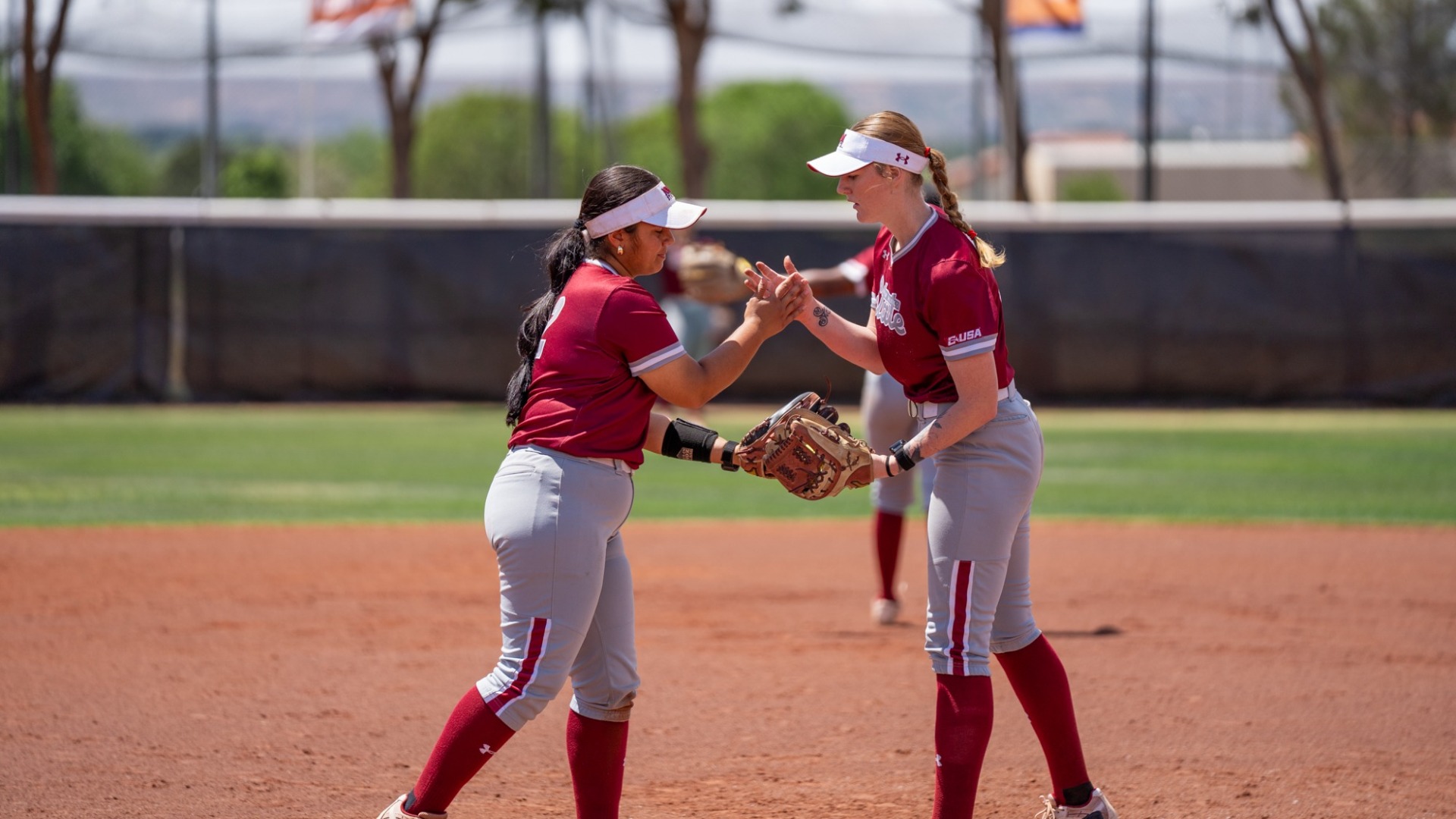 Taryn & Johnna celebrate after a play