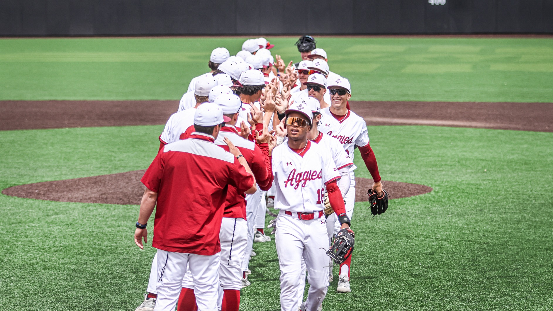 Team celebrates a sweep of Delaware after a win on April 4, 2026