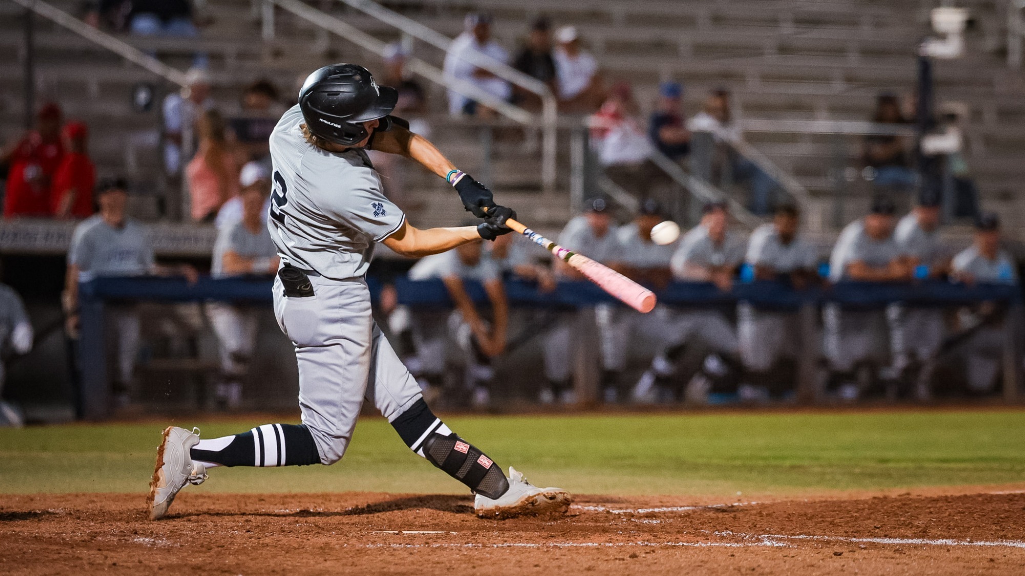 Camden Kaufman puts a ball in play against Arizona on April 8 in Tucson.