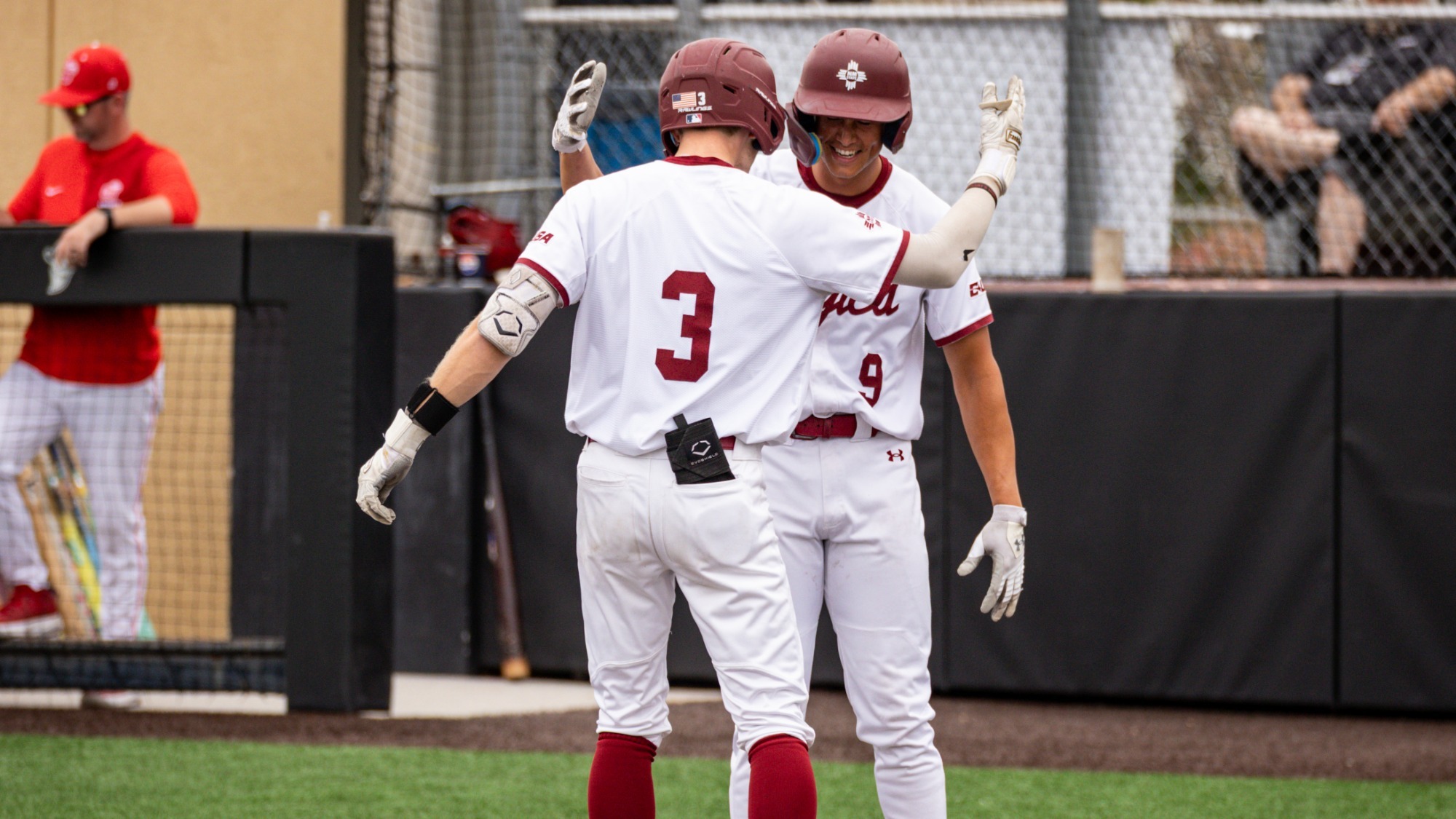 Aidan Lombardi and Aidan Taclas celebrate a home run.