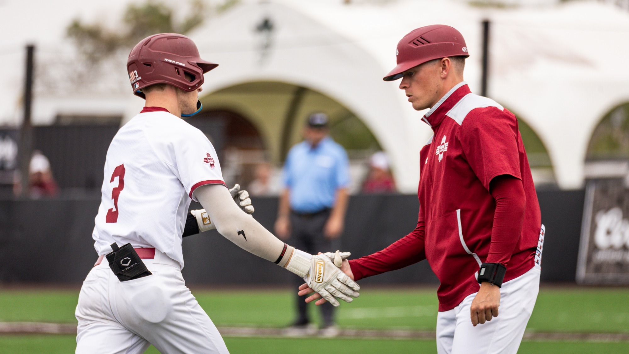 Aidan Lombardi high fives David Bellamy after a two-run home run against Liberty on May 3, 2026