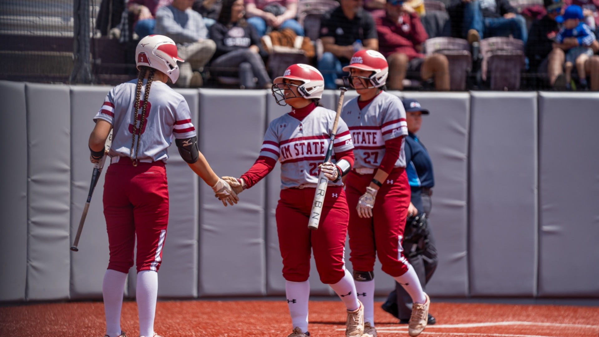 Aggies celebrate a run