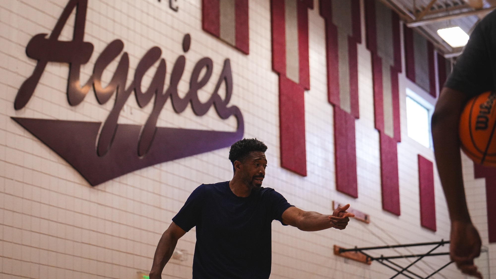 Adeniyi Amadou coaching in the practice gym
