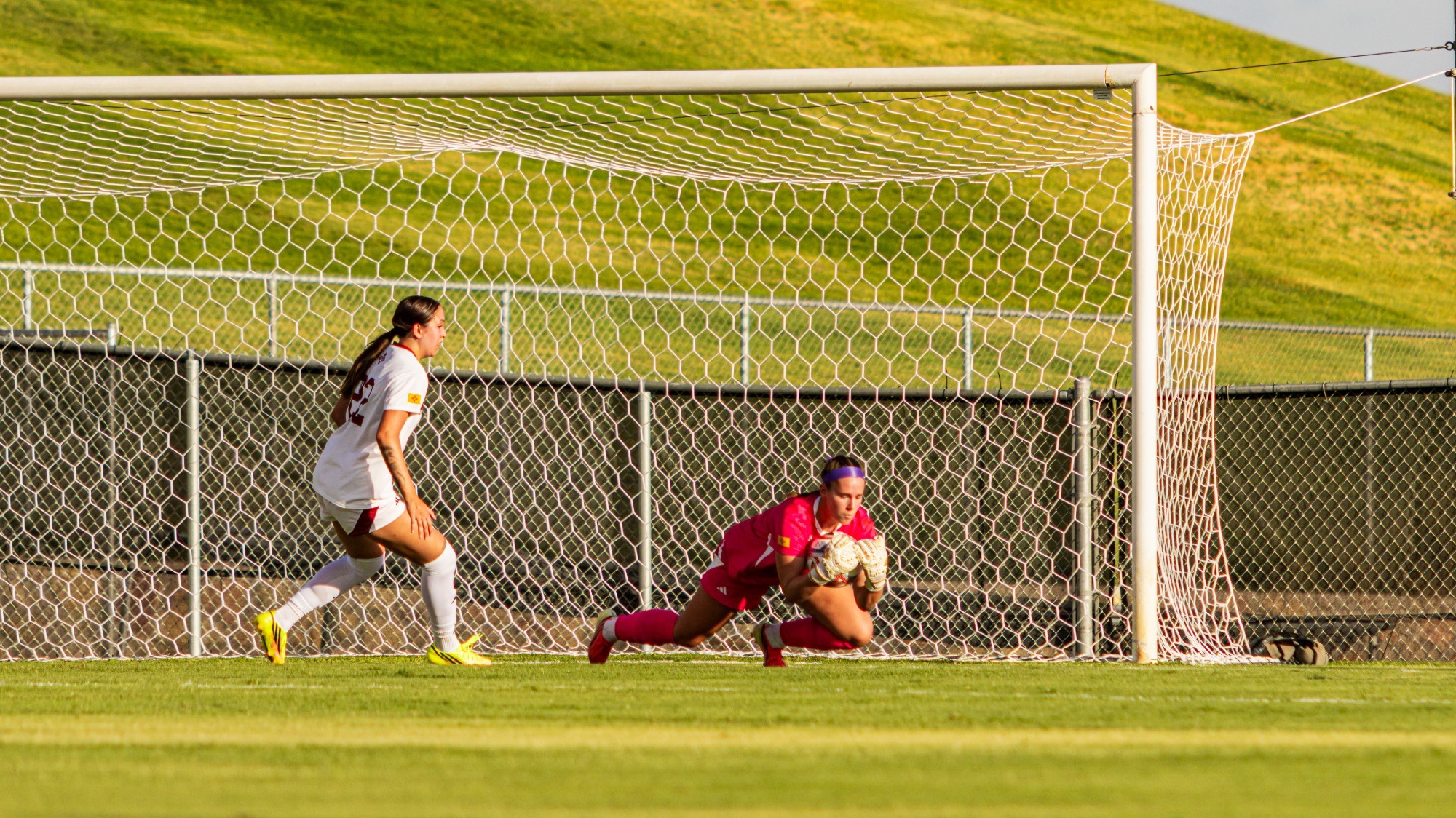 Karolanne Lafortune collecting a ball against Arizona State (8/12)