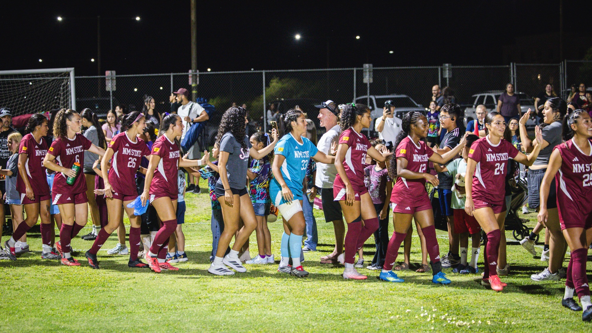 Team celebrating with the fans following home match with UNM (9/12)