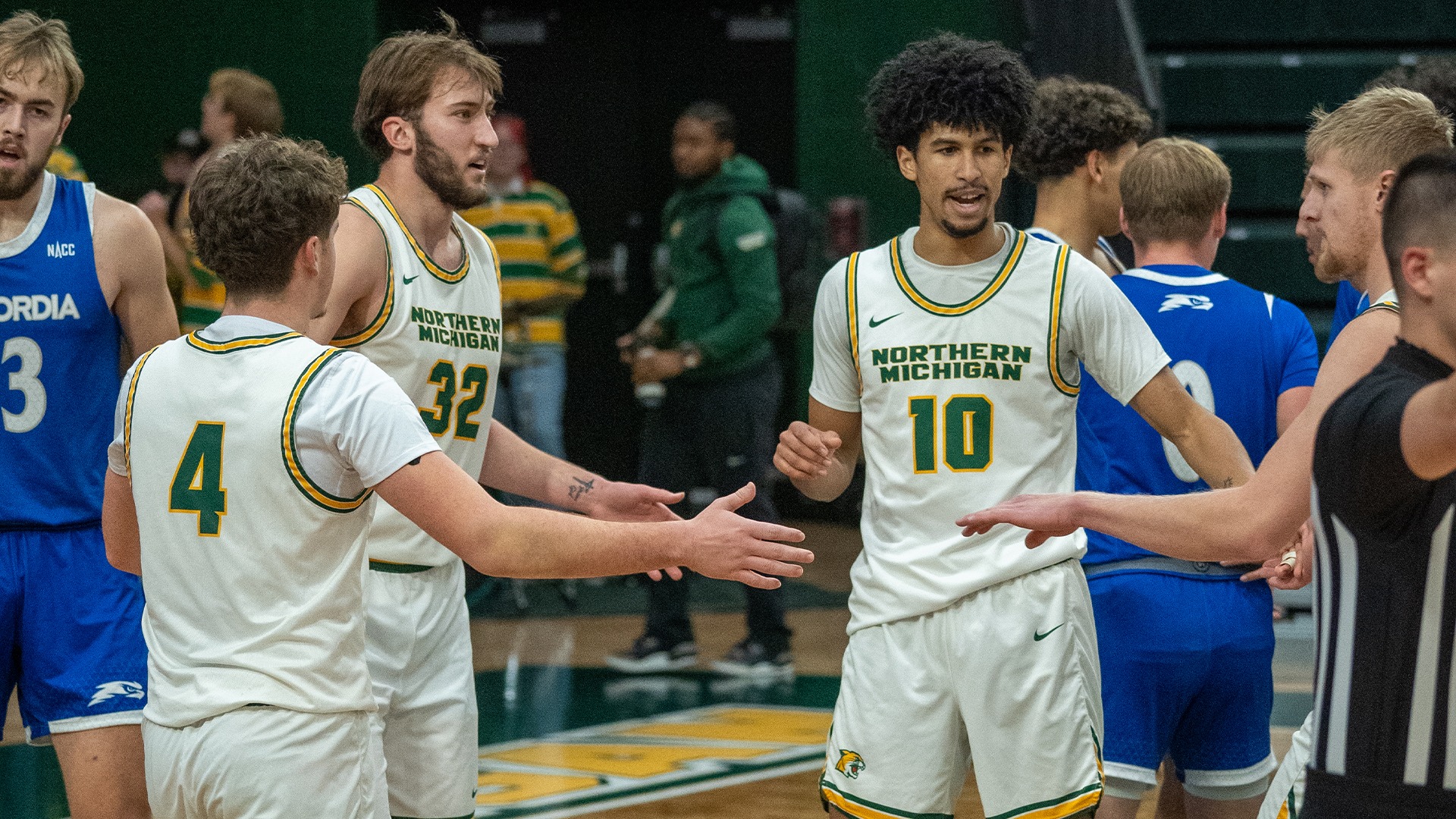 Four Wildcats meet after a play