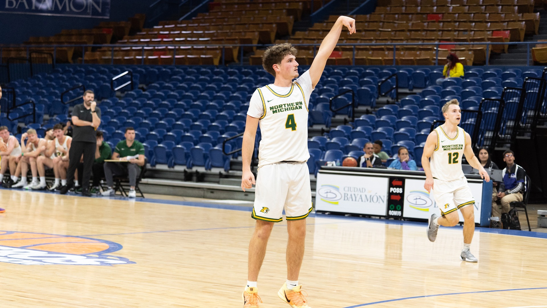 Cal Klesmit watches as he shoots a three