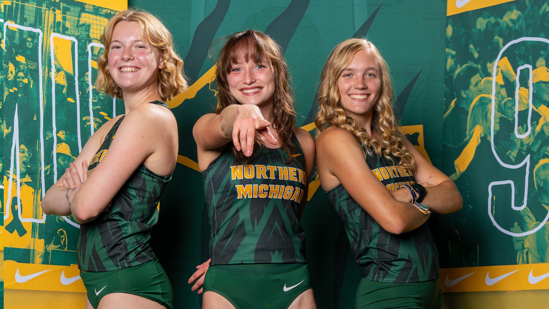 Three track and field girls pose for a picture