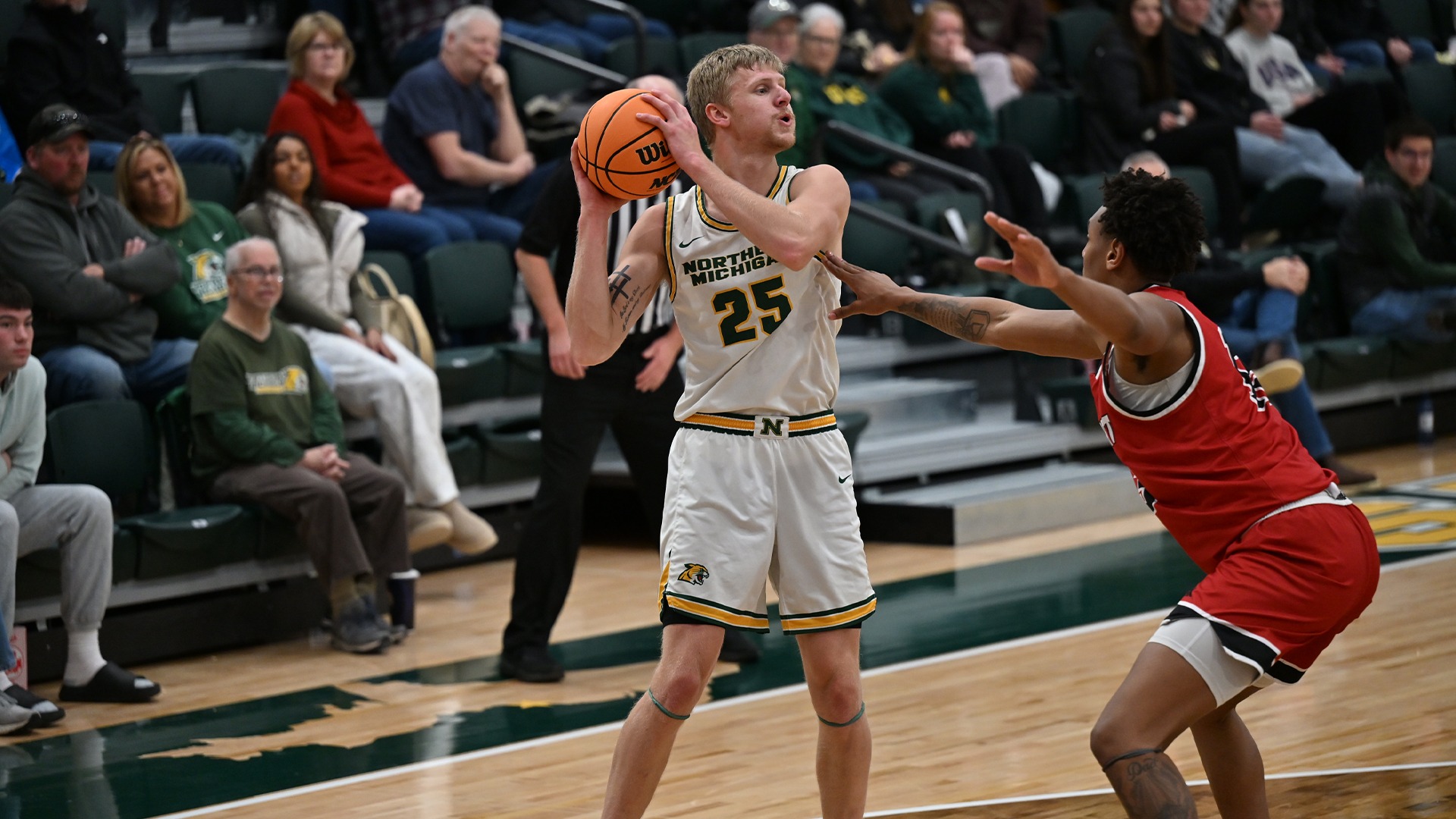 Dylan Kuehl looks beyond a defender