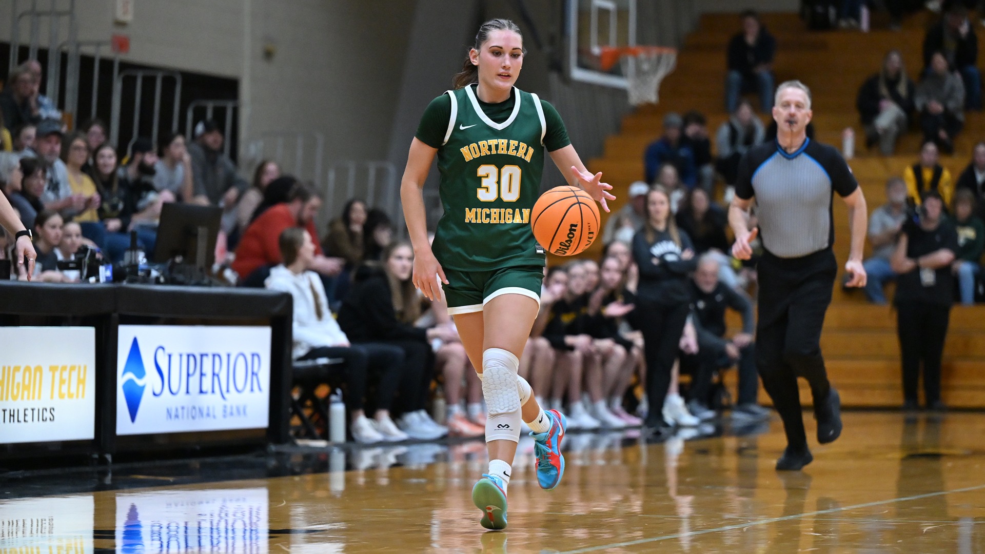 Jordyn Schmittdiel dribbles down the court
