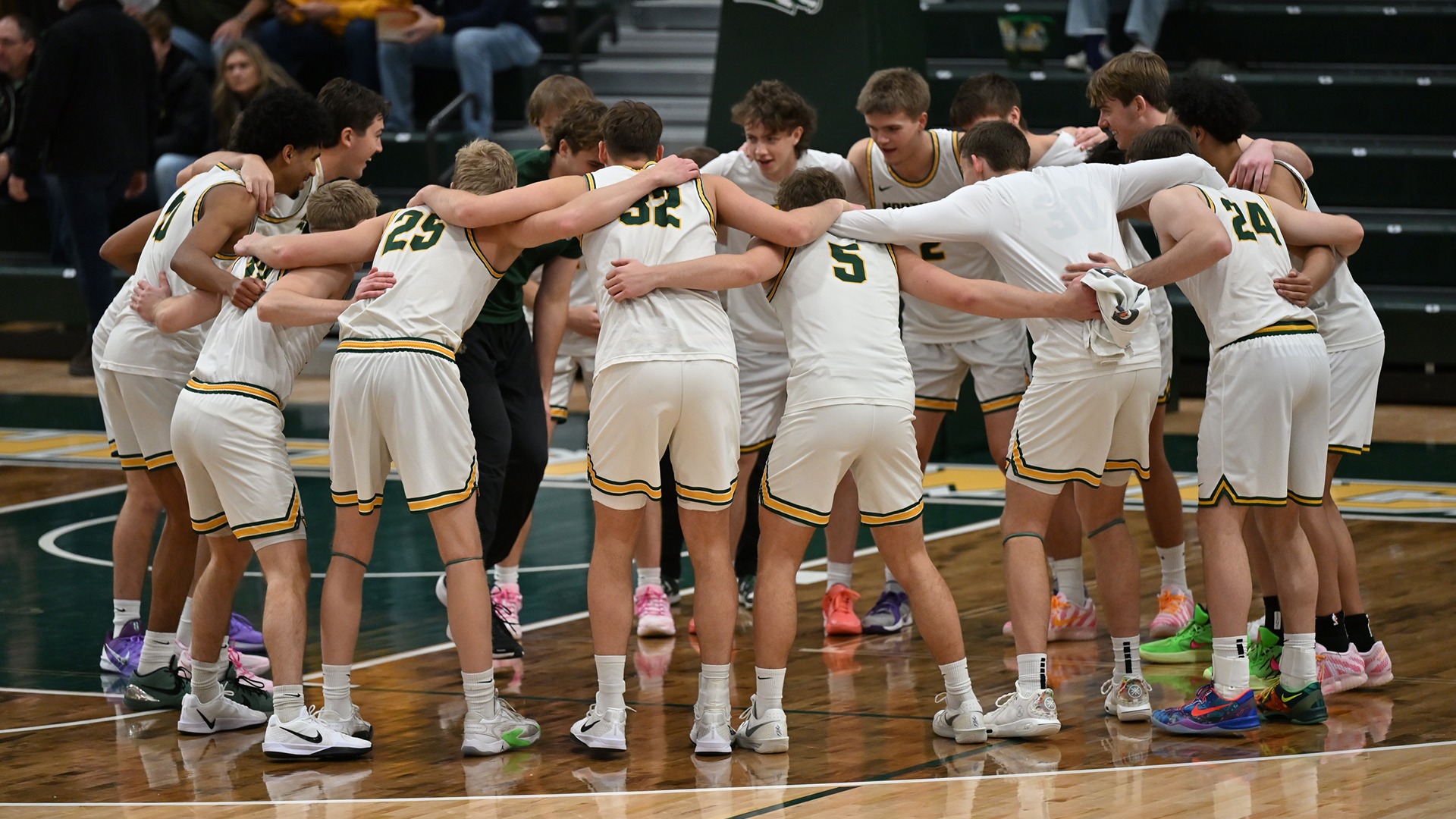 Men's basketball team huddle