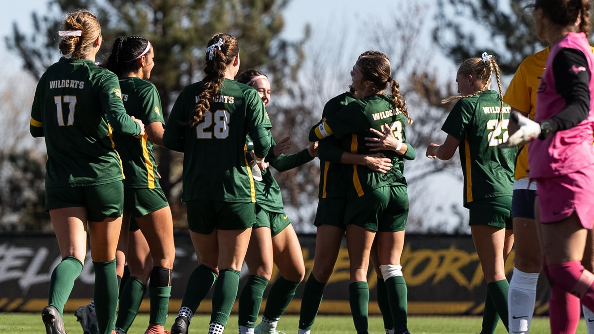 Women's Soccer Team celebrates scoring a goal