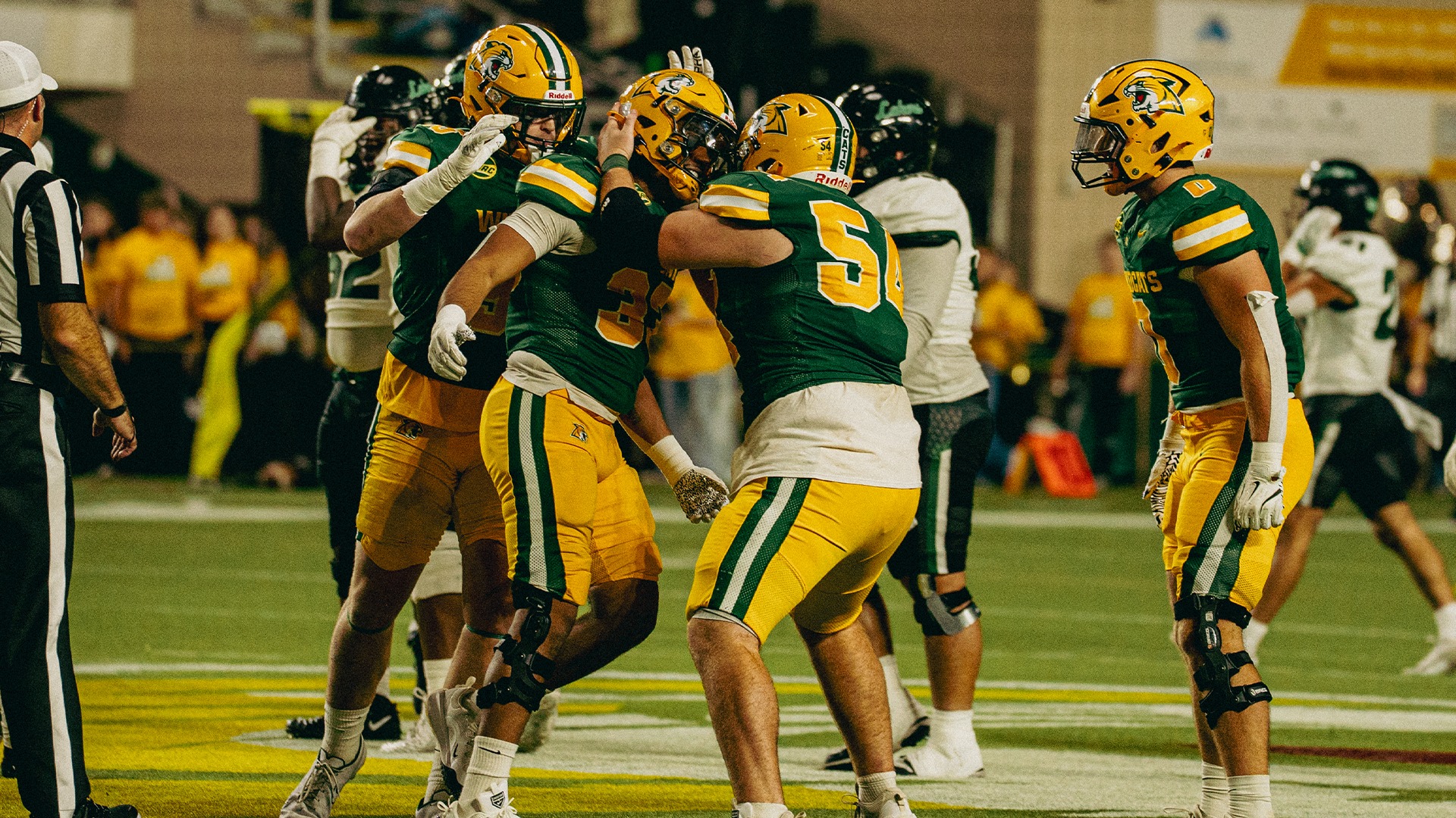Football defense celebrates