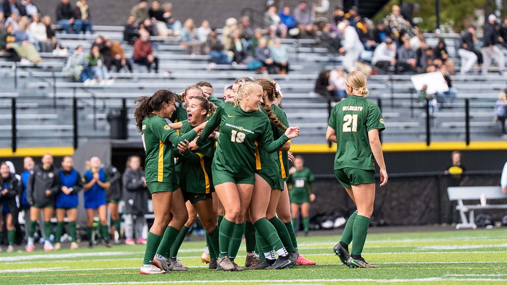 Women's soccer celebrates a goal against Michigan Tech