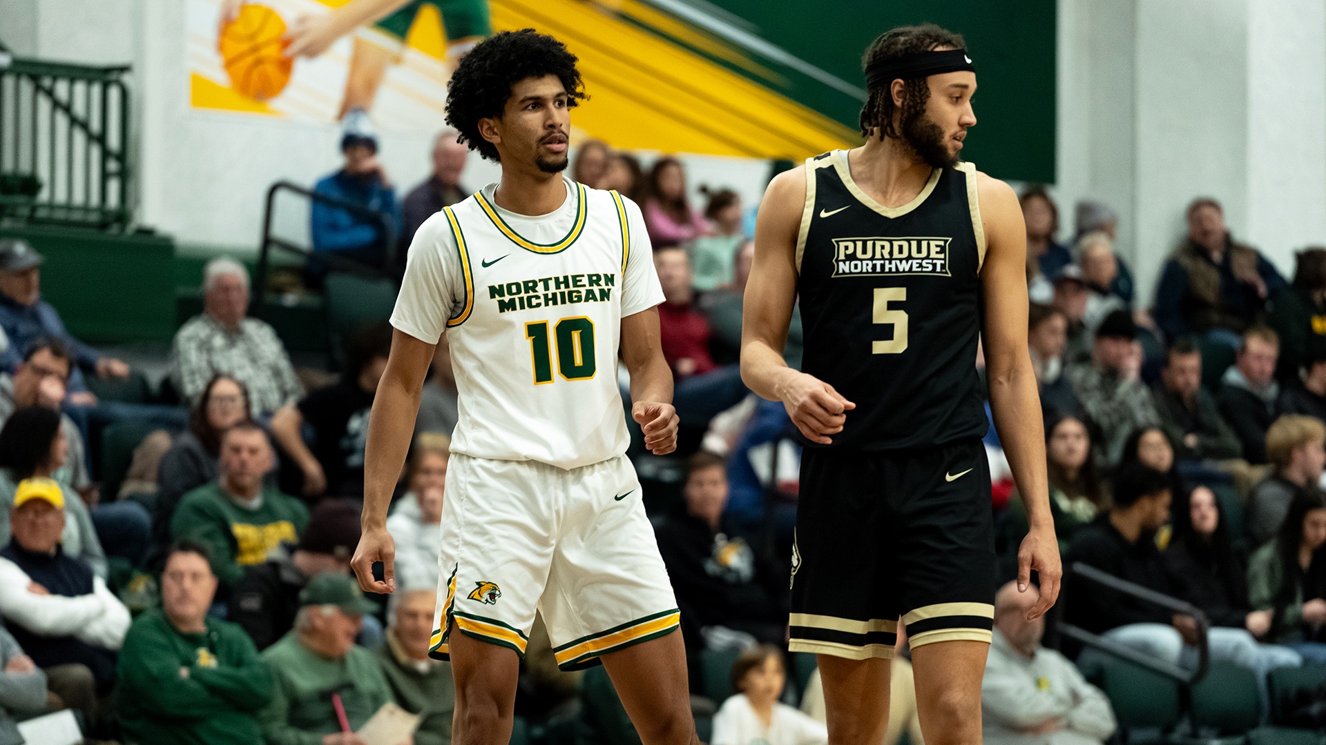 Trevor Polite and a Pride player get ready for a play