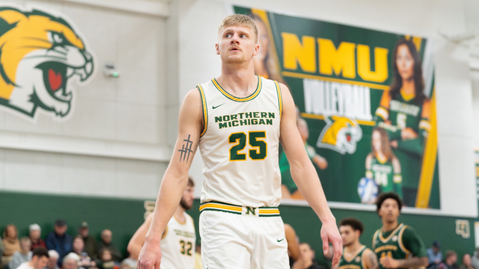 Dylan Kuehl looks on