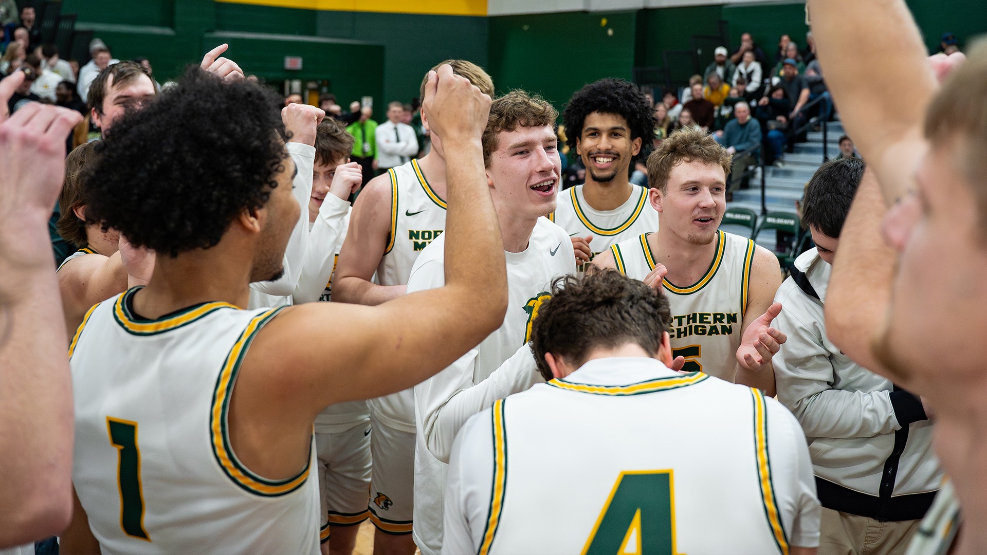 Men's basketball team huddle
