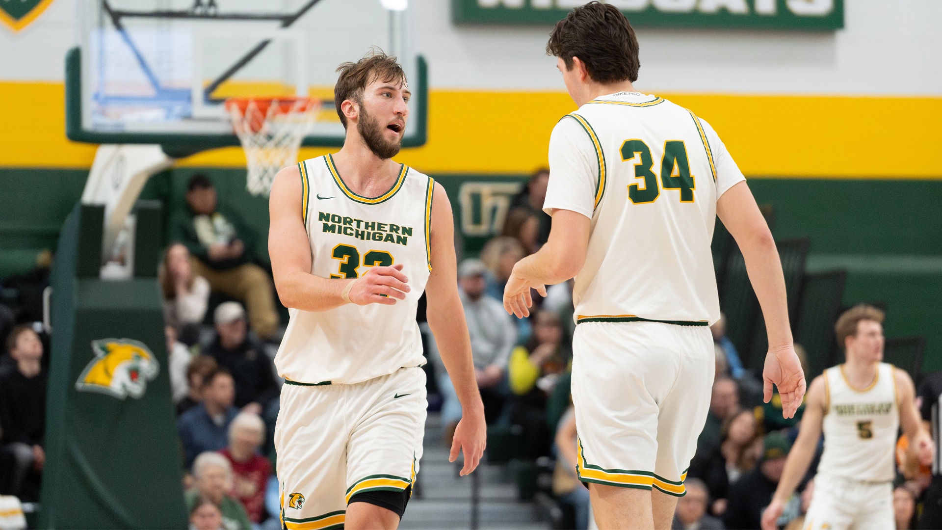 Jackson Dudek and Sam Privet go for a high 5