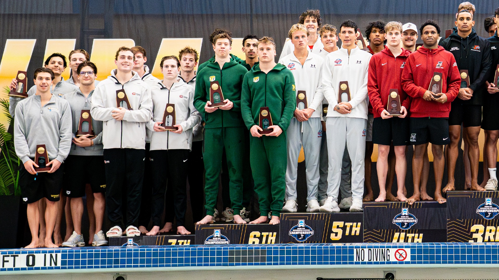 Men's 200 free relay team on the podium at the NCAA championships