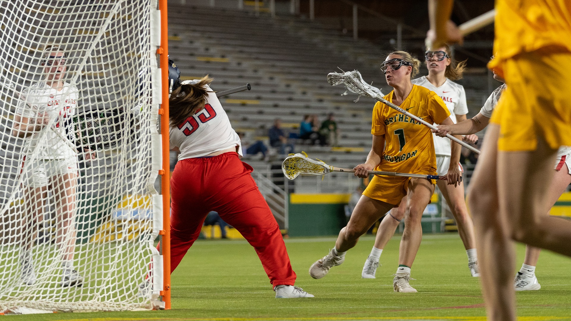 Lacrosse player Josie Lakosky shoots and scores against the Saginaw Valley State Cardinals in a home game during the 2025 season