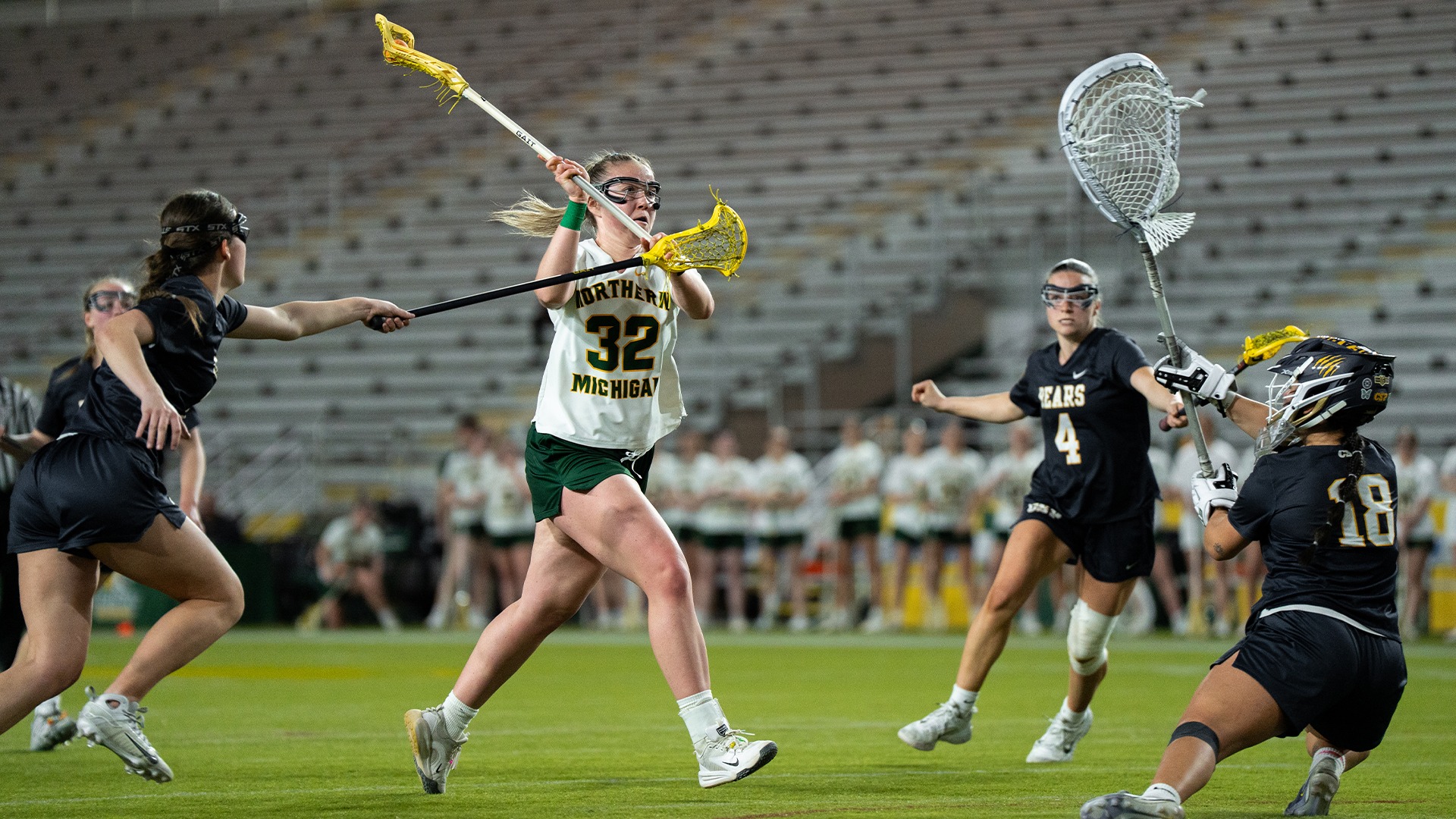 Abby Sisson shooting towards goal after cutting through a handful of Concordia-St. Paul defenders during a home game in the Superior Dome