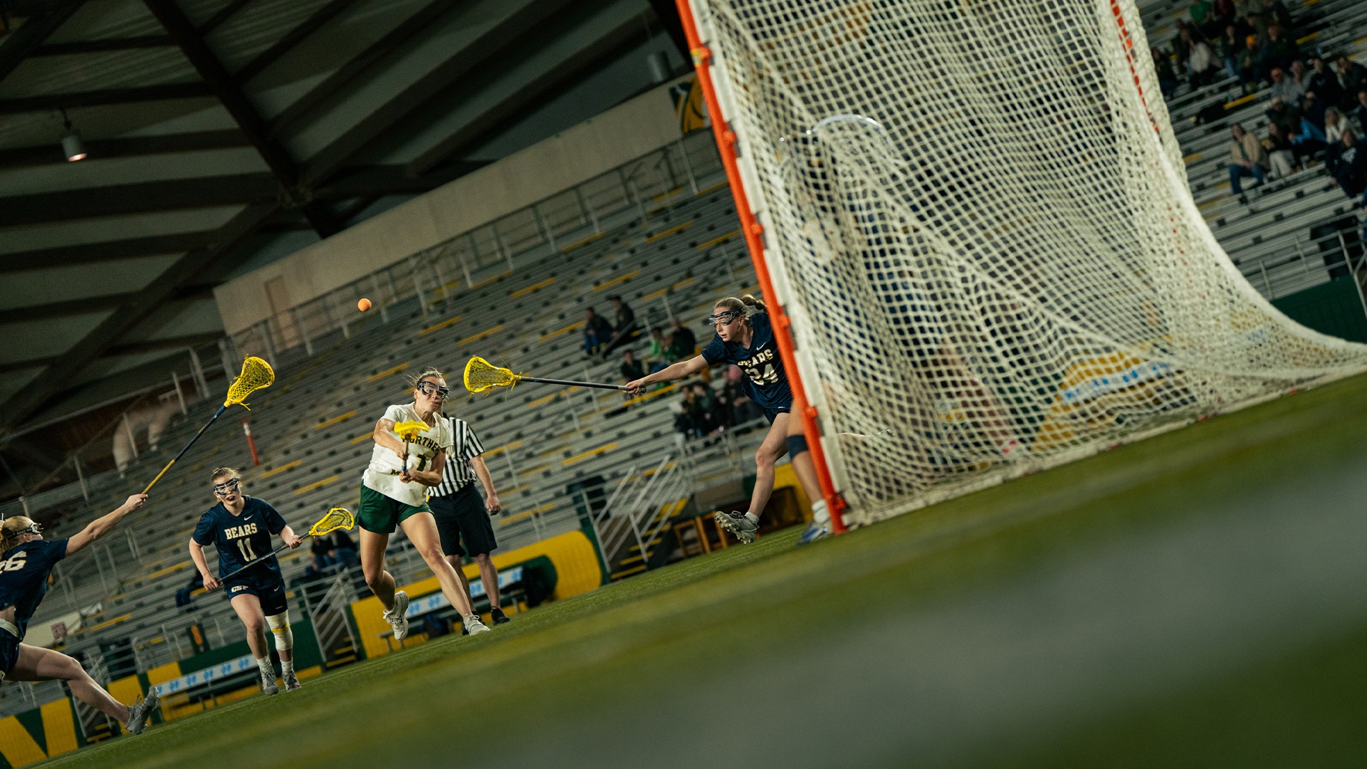 A low angle dynamic shot of Josie Lakosky shooting a free position shot against Concordia-St. Paul