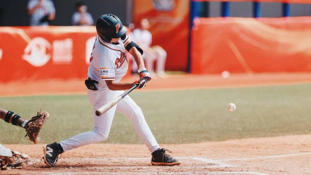 Yaboub Rayan swinging a baseball bat for Palestine at the Asian Baseball Championships