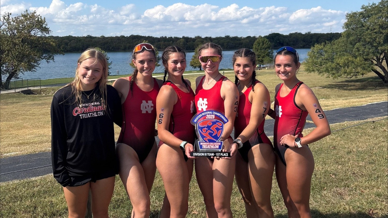 The North Central women's triathlon team posing with their 2025 USA Triathlon West Regional Champions trophy
