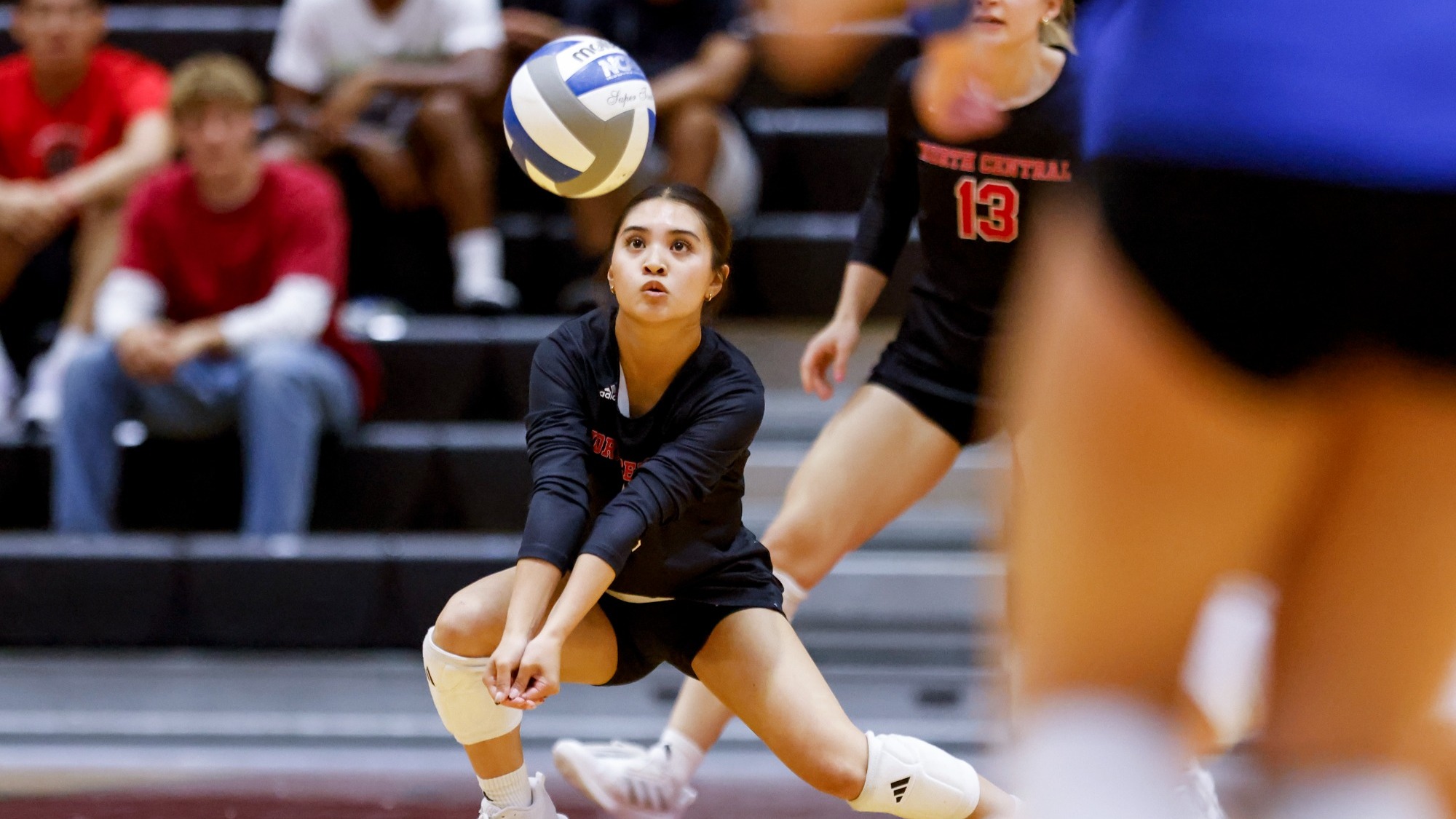 Demi Carpio digging the volleyball
