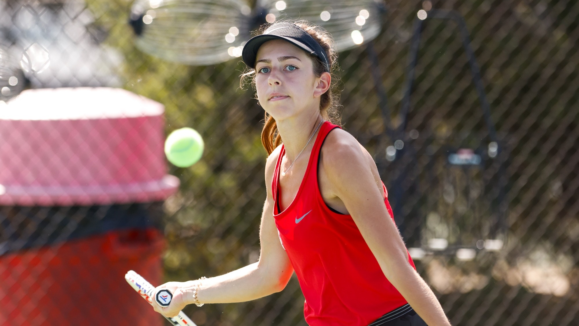 Kate Herlihy returning a tennis ball
