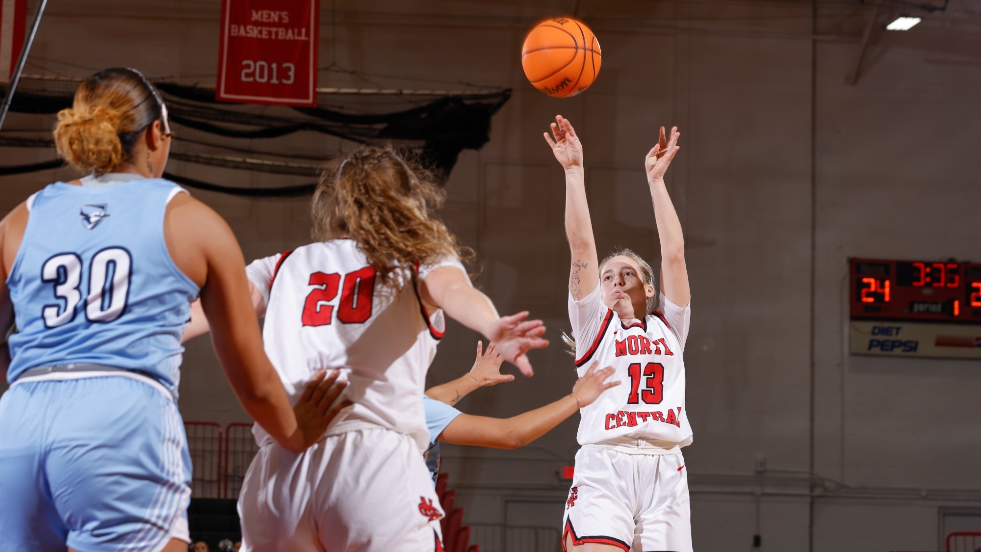 Kennedy Hartwig pulling up for a jumper against Elmhurst in the 2024-2025 season.