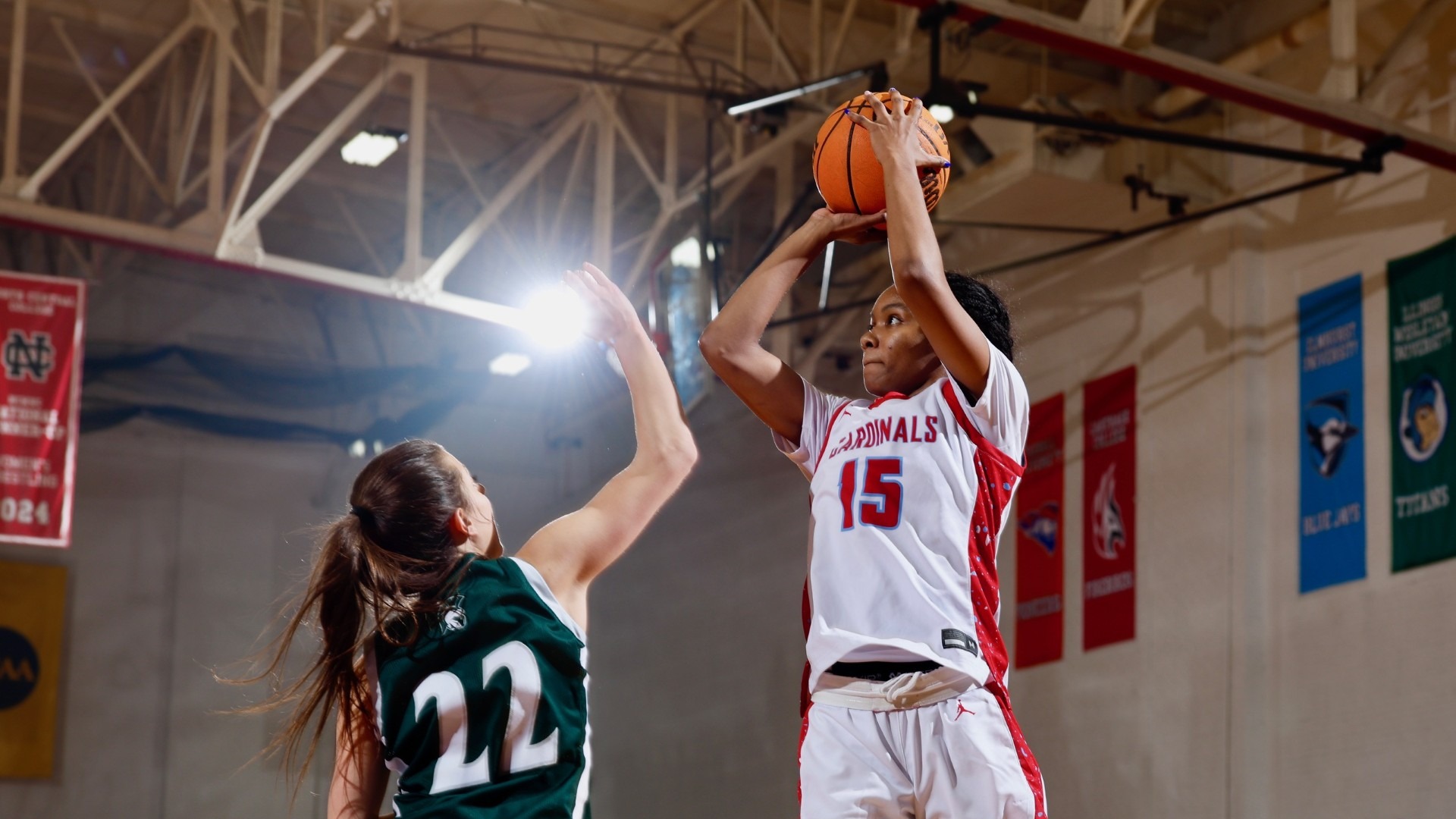 Jocelyn Trotter pulling up for the jumper above her Illinois Wesleyan defender in the CCIW match-up on Dec. 6, 2025.