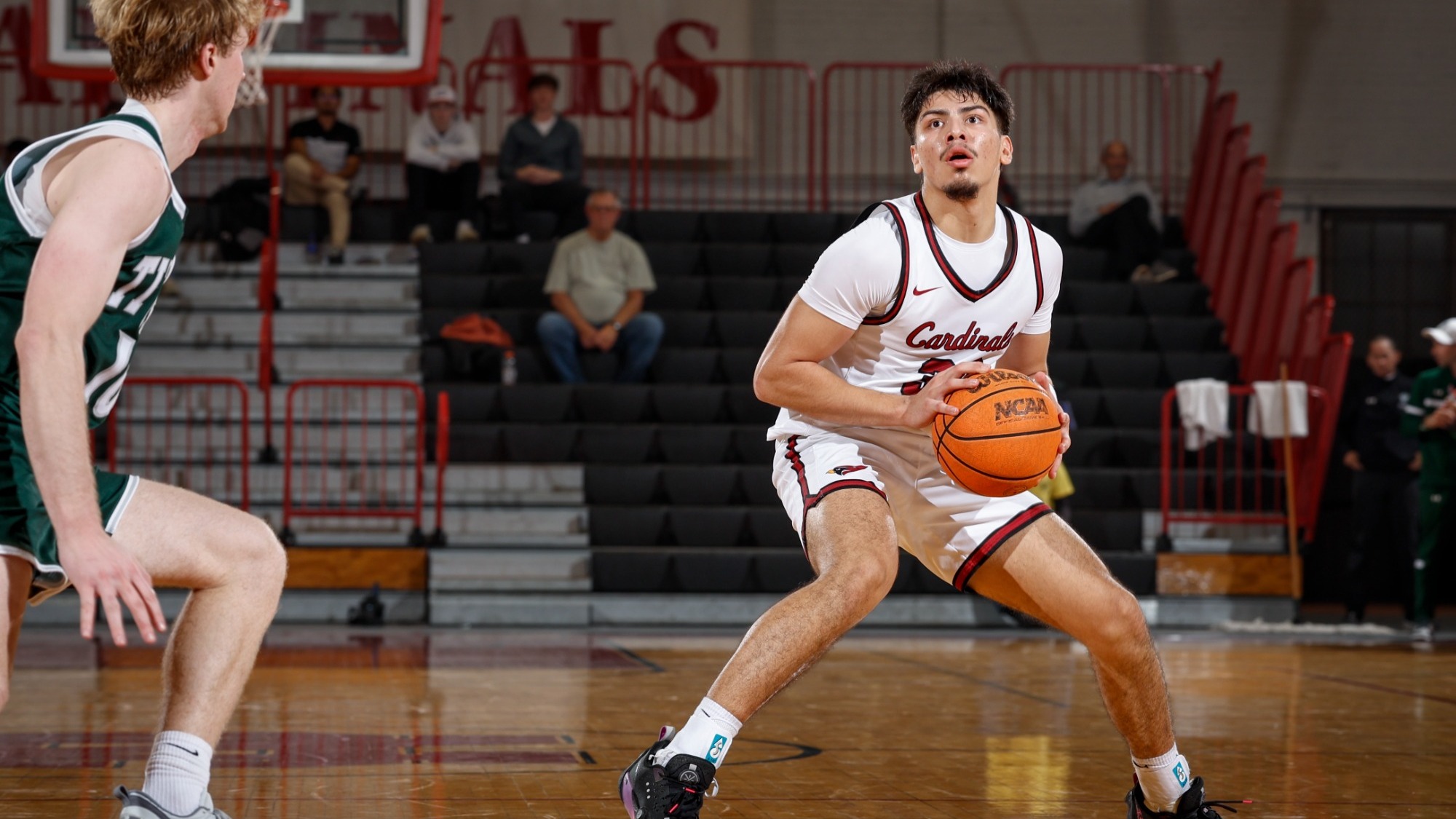 Alejandro Diaz creating space to shoot against Illinois Wesleyan
