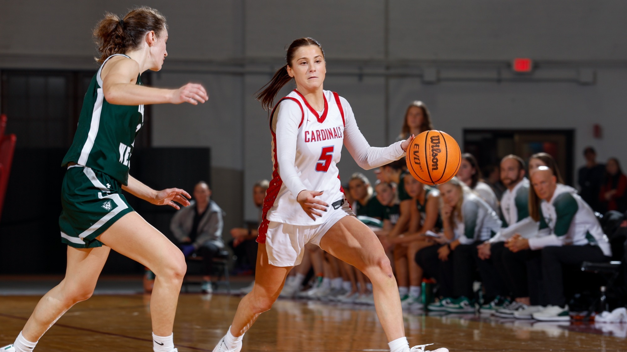 Grace Kieffer dribbling against her Illinois Wesleyan defender on Dec. 6, 2025. 