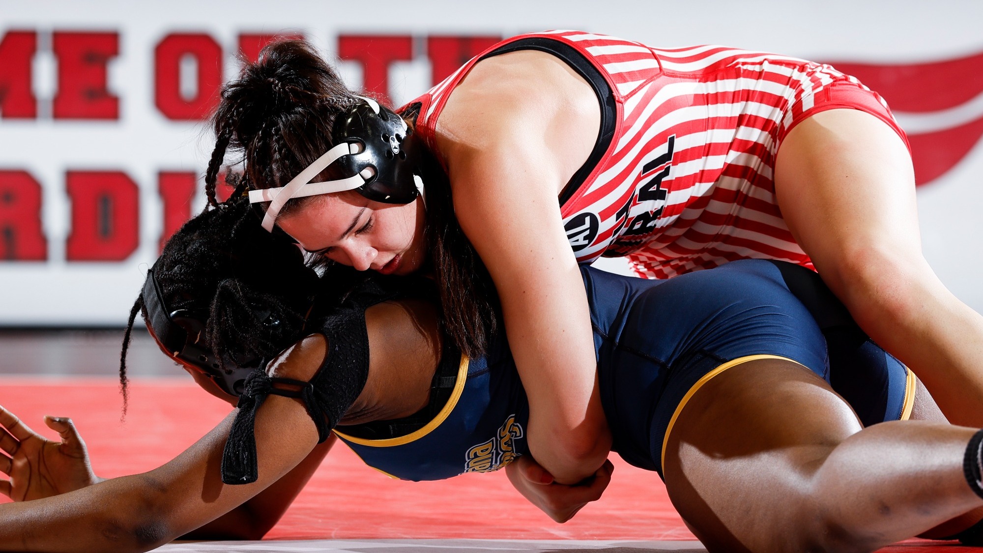 Sydney Perry takes down her Augustana opponent