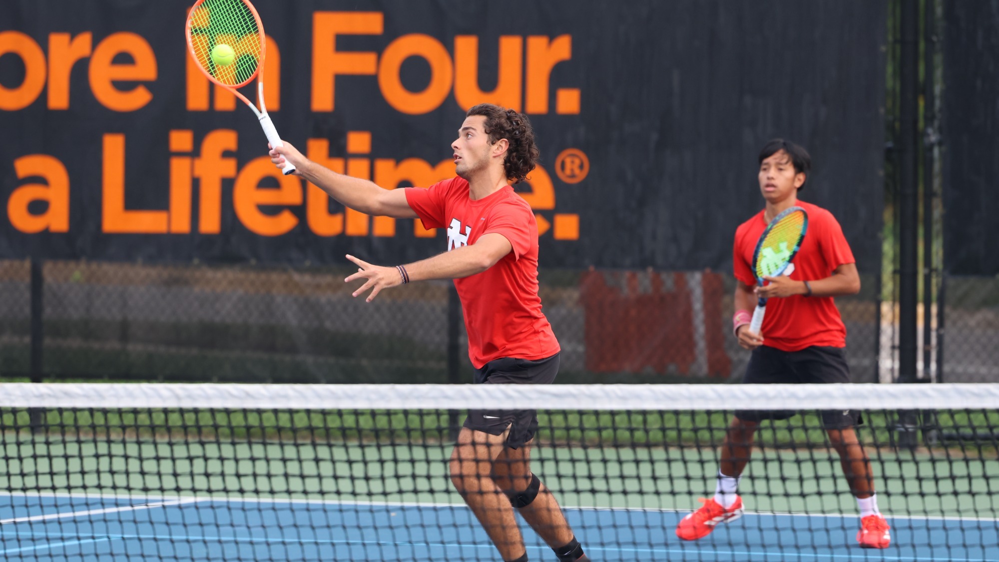 The North Central College Men's Tennis team competing in doubles action at the ITA Central Regional Championships on Sep. 27