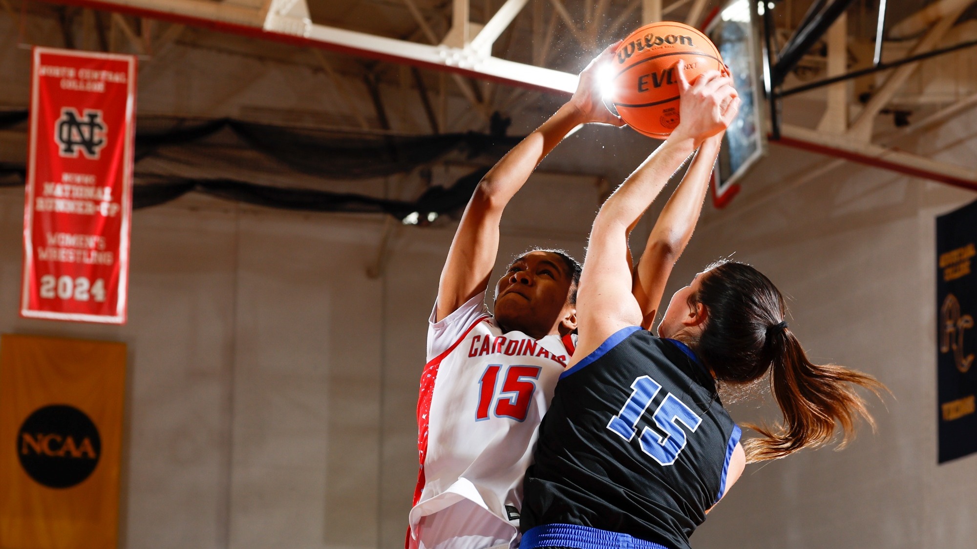 Jocelyn Trotter going up against her Aurora defender in a contested layup on Dec. 30, 2025.