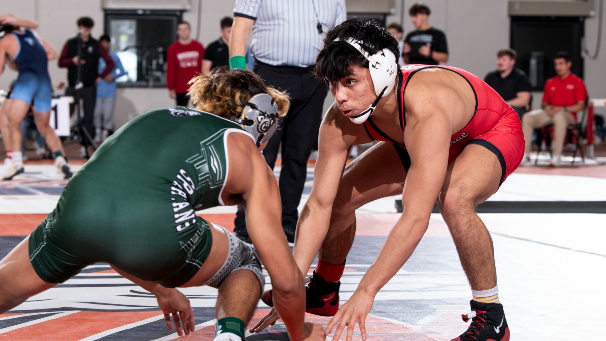 Xavier Villalobos in a stance with opposing wrestler