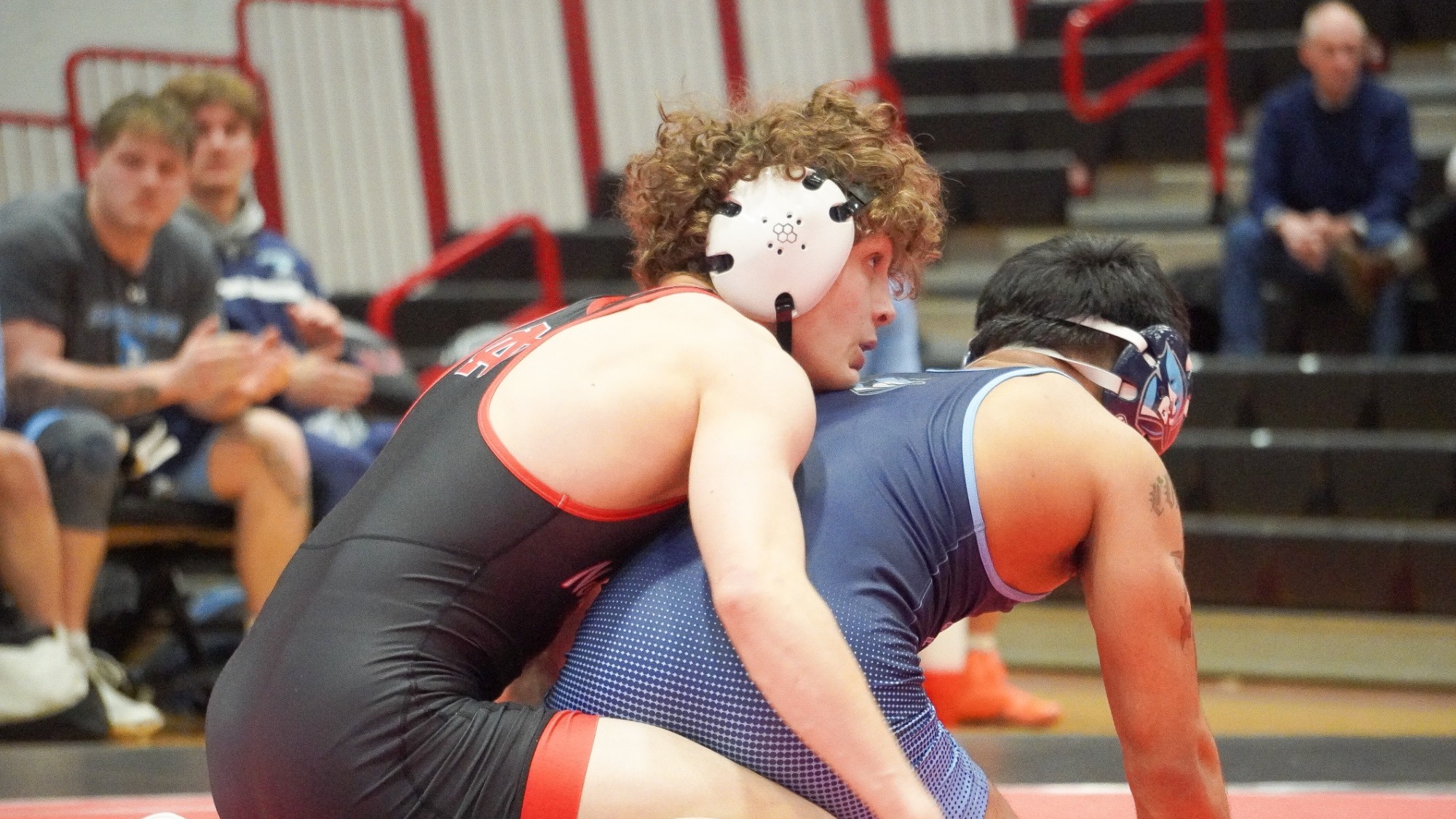 Joey Sikorsky with top control of Elmhurst wrestler