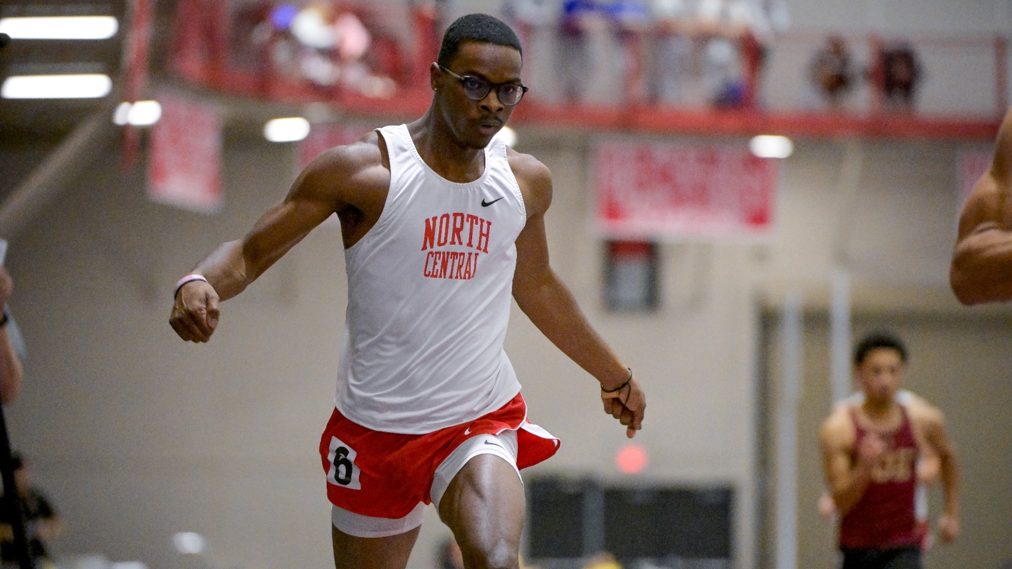 Randy Reed crosses finish line of the 200m dash