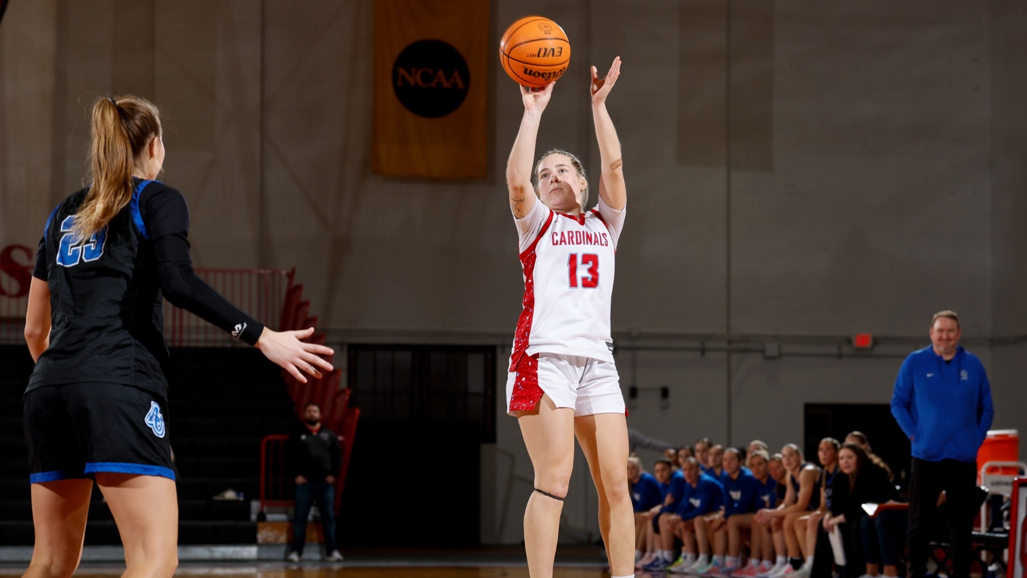 Kennedy Hartwig rising up above her Aurora defender beyond the arc in the match-up on Dec. 30, 2025.
