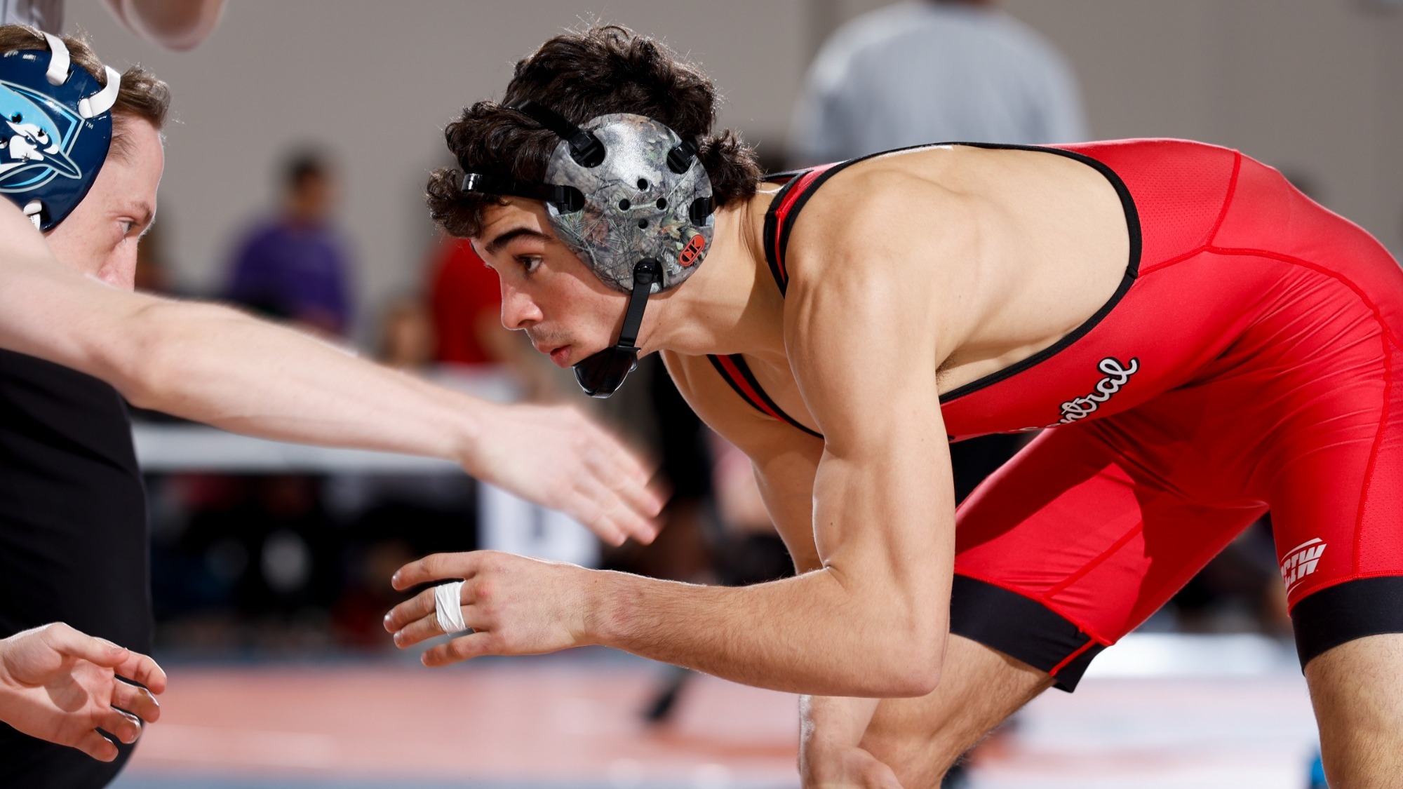 Chip Guzman battles for position against Elmhurst Wrestler