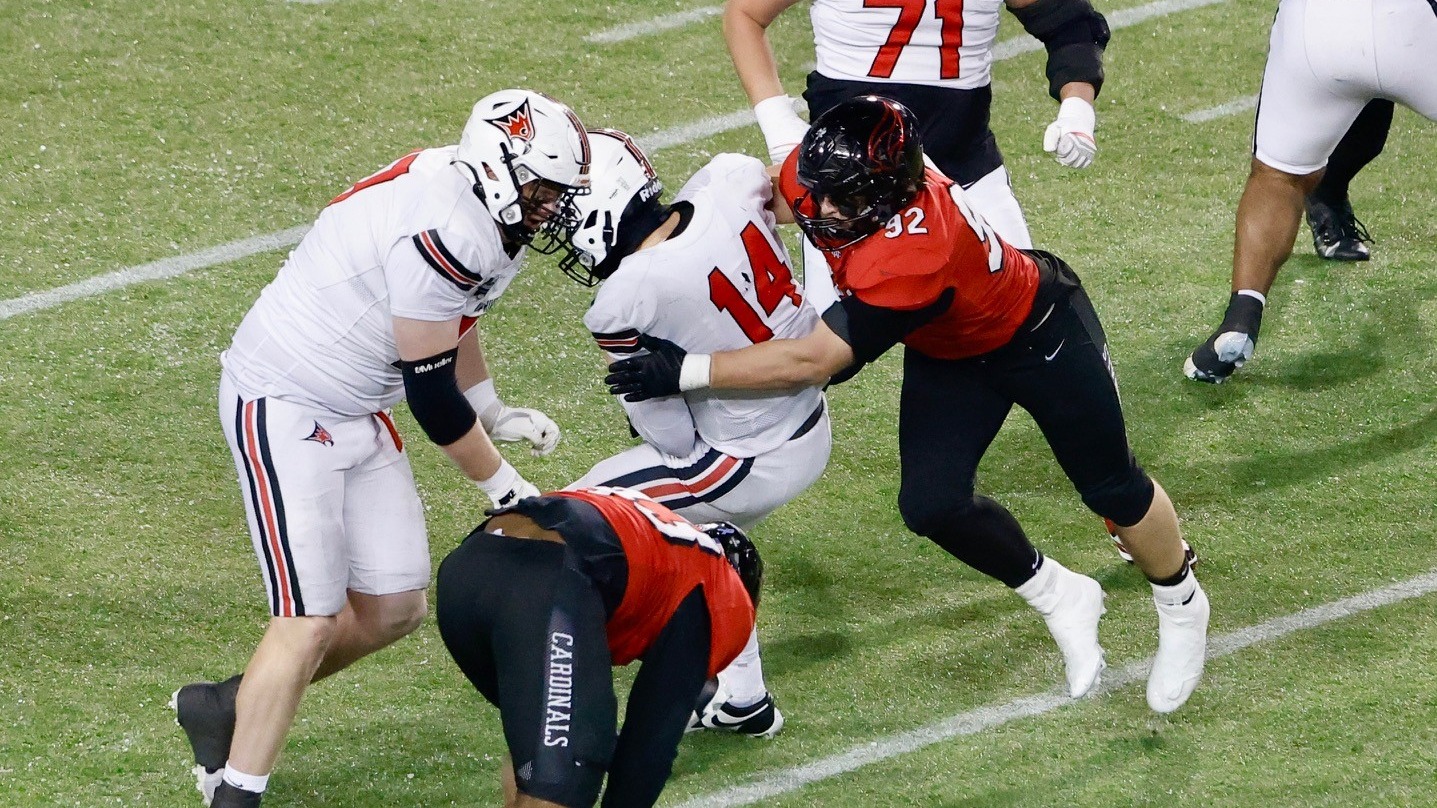 John Sullivan sacking the quarterback in the Stagg Bowl