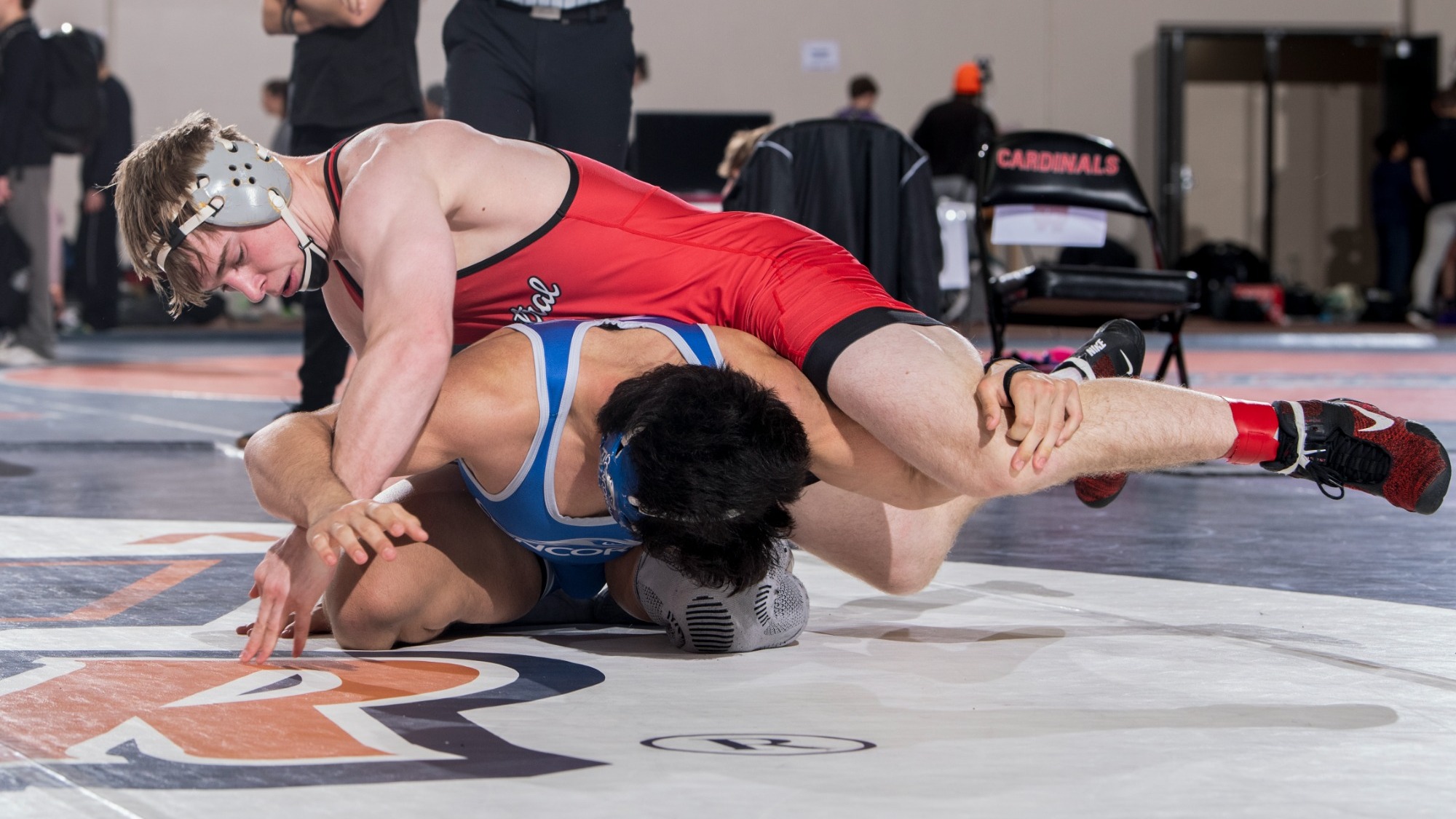 Casey Aikman with top control of a wrestler