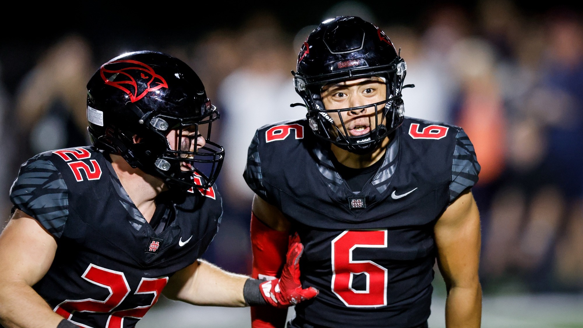Ethan-Micah Enriquez celebrates after an interception by flexing.