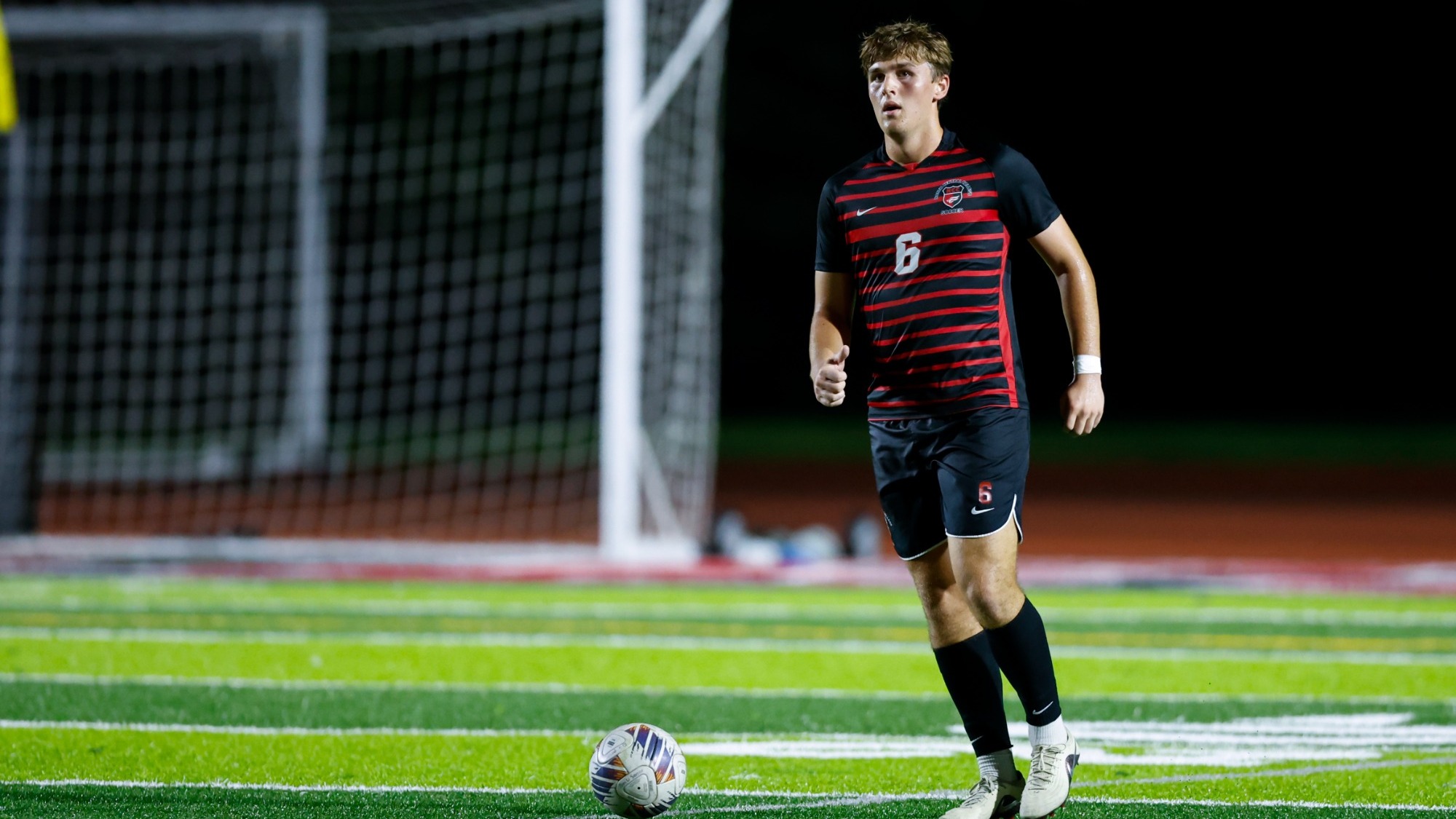 North Central College men's soccer student-athlete Griffin French dribbling the ball against Benedictine University on Sept. 3, 2026