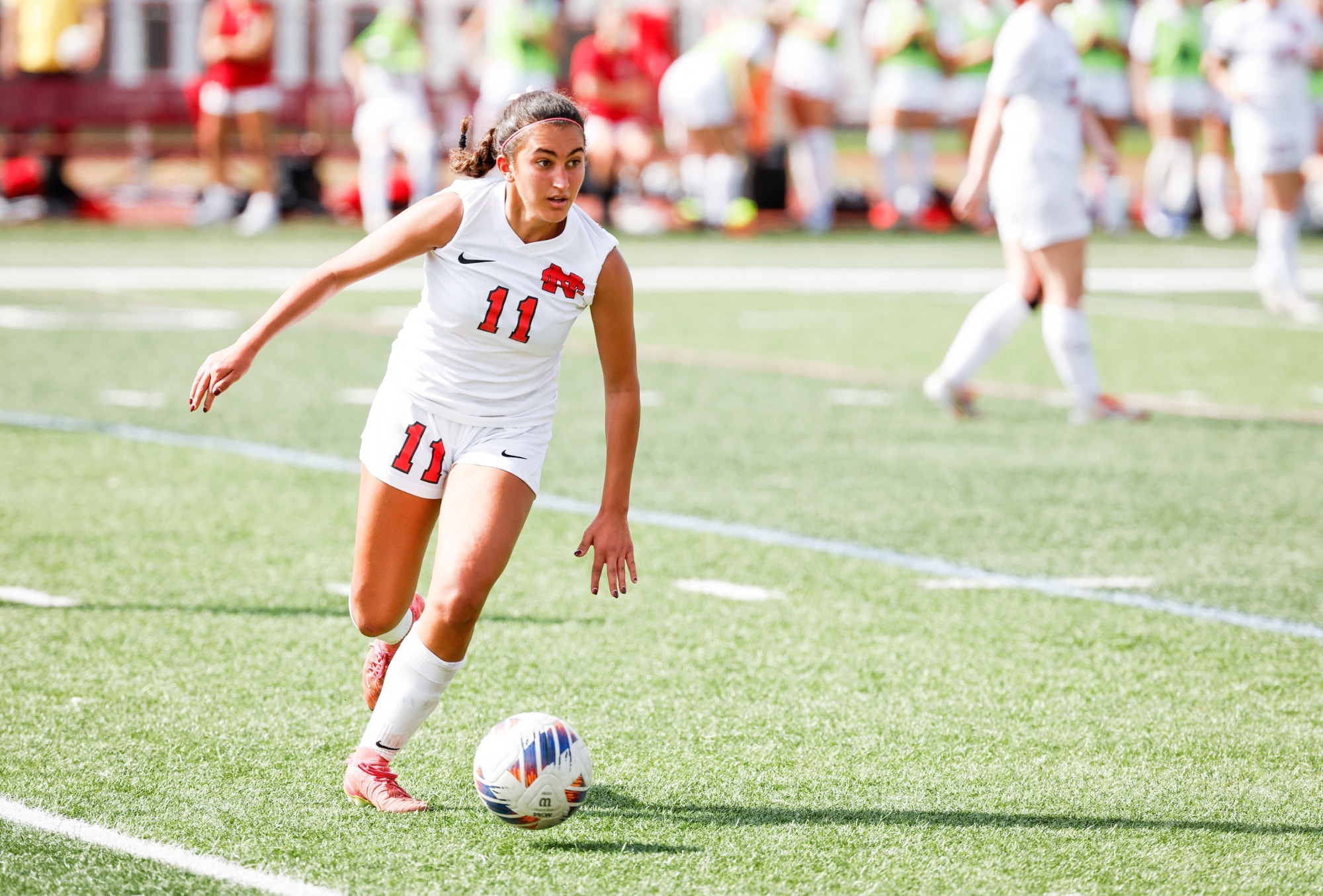 Claire Georgees looks brings the ball upfield against Carroll