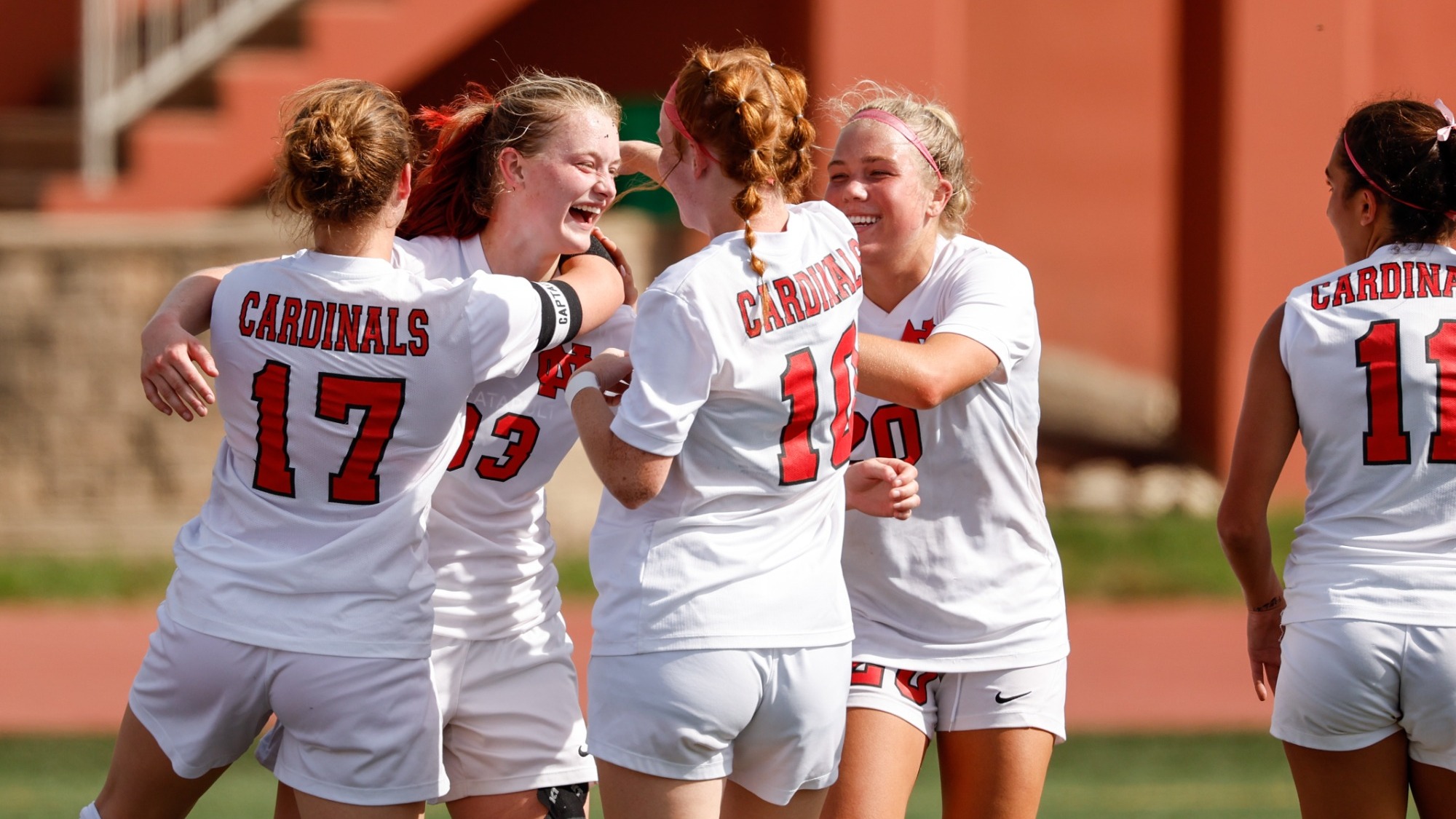 Women's soccer celebrates goal against Carroll
